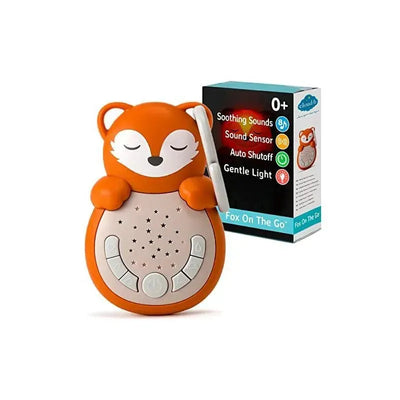 Fox-shaped sound machine with a gentle light, featuring buttons for soothing sounds and sound sensor, packaged in a retail box.