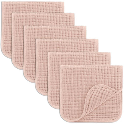 Muslin burp cloths in blush color, featuring a soft, textured surface, with five cloths stacked neatly for display.