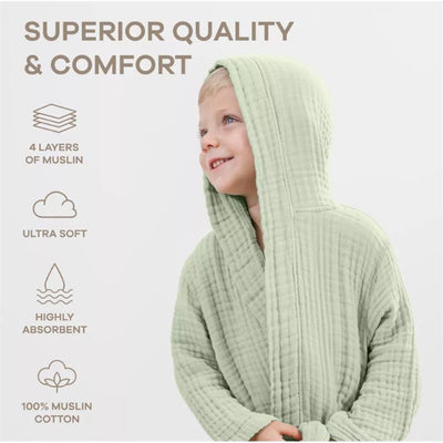 Sage green muslin kids bathrobe on a smiling child, highlighting softness and absorbency features.
