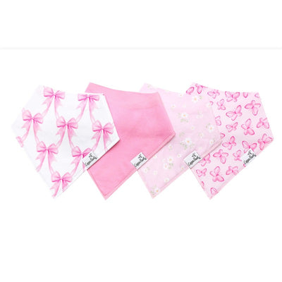 Four baby bandana bibs in shades of pink, featuring designs of bows, solid colors, flowers, and butterflies.