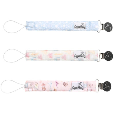 Disney Princess Binky Clip by Copper Pearl, featuring three colorful clips with various whimsical patterns.