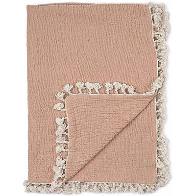 Copper red baby muslin swaddle blanket featuring a textured surface and decorative cream tassels along the edges.