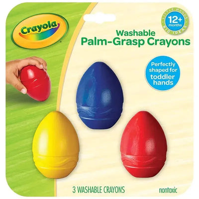 Three palm-grasp washable crayons in red, blue, and yellow, designed for toddlers’ hands, with a hand holding a red crayon.