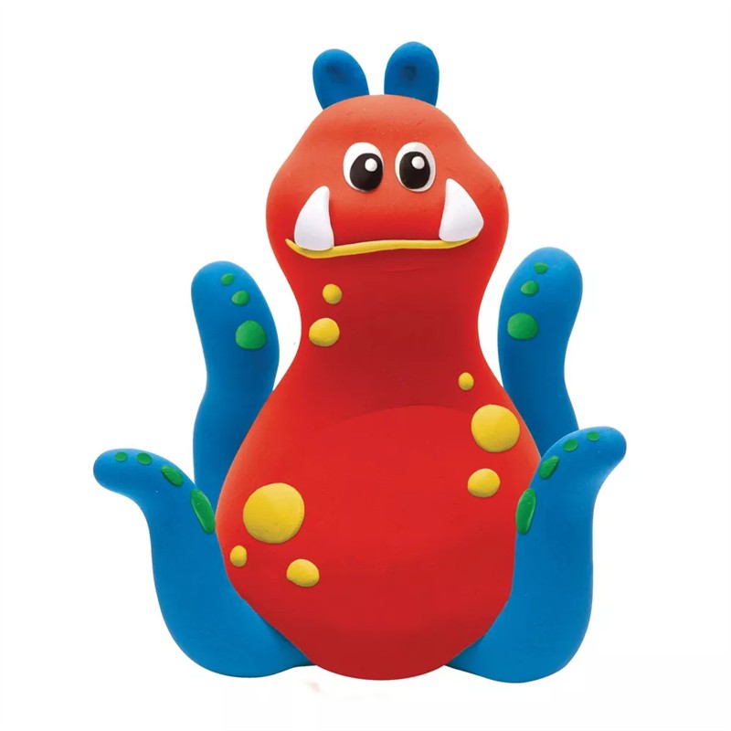Colorful red and blue monster figure made from Crayola Model Magic, featuring large eyes, fangs, and colorful spots.