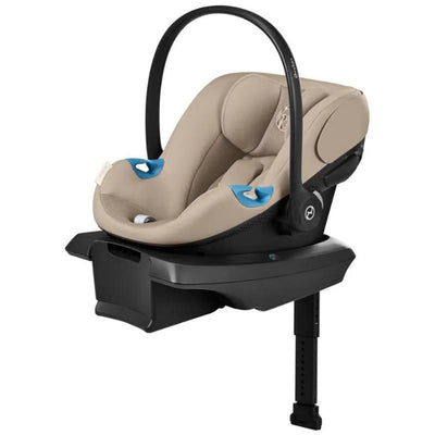 Cybex Aton G2 infant car seat in almond beige color with a load leg base and blue accents for secure installation.