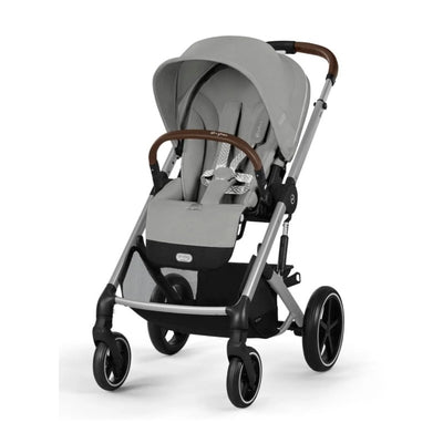 Cybex Balios S Lux stroller in Stone Grey with a brown handlebar, featuring a spacious seat and large wheels for stability.