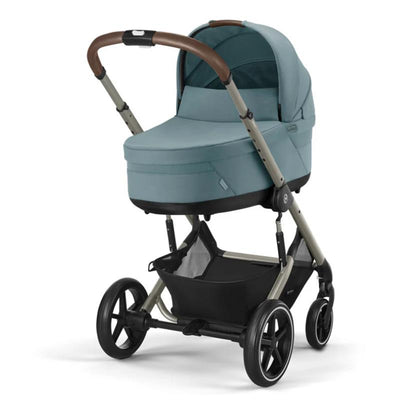 Cybex Balios S Lux Stroller in Stormy Blue, featuring a removable bassinet, sleek design, and large wheels.