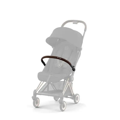 Cybex Coya Bumper Bar in dark brown color, designed for a compact stroller, showcasing a curved handle and fasteners.