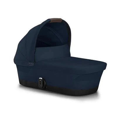 Cybex Gazelle S Cot in Ocean Blue, featuring a hood, spacious interior, and a secure fastening mechanism.