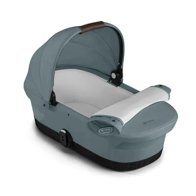 Cybex Gazelle S Cot in Sky Blue with a soft interior and adjustable canopy, designed for safety and comfort.