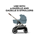 Cybex Gazelle S Cot in Stormy Blue, designed for use with e-Gazelle and Gazelle S strollers, shown in profile.