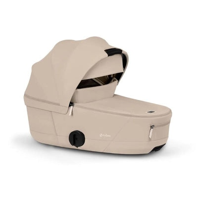 Cybex Mios/Coya Fold Lux Carry Cot in Cozy Beige with a canopy, designed for infant transport, featuring a sleek, modern design.