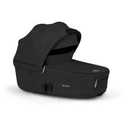 Cybex Mios/Coya Fold Lux Carry Cot in Sepia Black, featuring a sleek design and zippered opening for easy access.