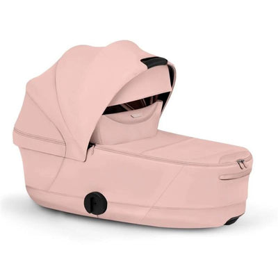 Cybex Priam Fold Carrycot in Peach Pink Light, featuring a sleek design and a zippered closure for easy access.