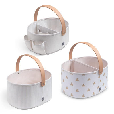 Nested fabric storage bins in tan, featuring soft handles and various interior compartment designs.