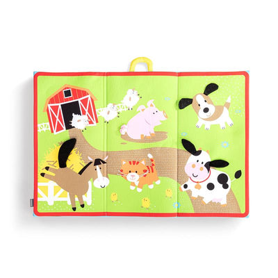Colorful folding travel playmat featuring barnyard animals, including a cow, pig, horse, and dog, with a red barn illustration.