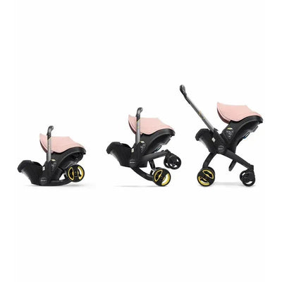 Doona infant car seat and stroller in blush pink, depicted in three adjustable configurations with black wheels.
