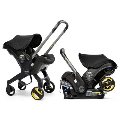 Doona Infant Car Seat with Base and Stroller in Nitro Black, featuring a sleek design with yellow accents.