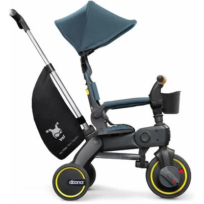 Doona Liki Trike S5 in Ocean Blue, a foldable tricycle with adjustable canopy, safety features, and front storage.