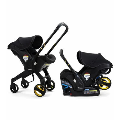 Doona Infant Car Seat with Base and Stroller in Midnight color, featuring a sleek black design and yellow accents.