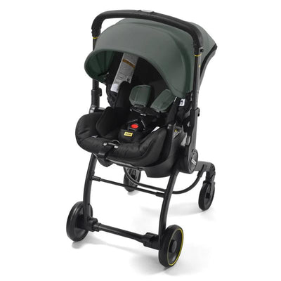 Doona X Infant Car Seat in Slate Green with a Latch Base, featuring a low-profile design and adjustable canopy.