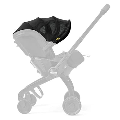 Doona X Summer Canopy in Nitro Black, featuring a sleek black fabric with mesh paneling for ventilation, mounted on a Doona stroller.