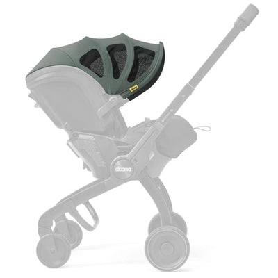 Slate green Doona X Summer Canopy attached to a stroller, offering sun protection with a stylish design.