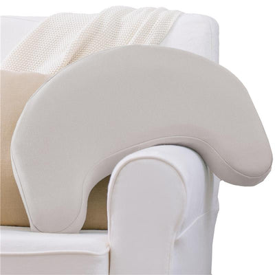 Light gray Dr. Brown Feeding & Nursing Lap Support Pillow resting on a couch, designed for comfort during feeding.