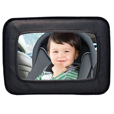 Backseat mirror allowing drivers to see a smiling toddler in a car seat, enhancing rear visibility and safety.