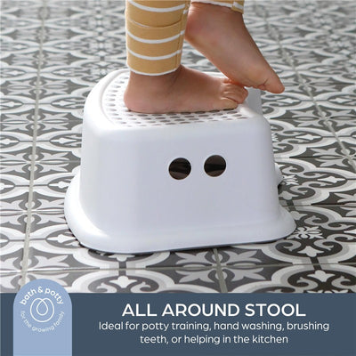 Step stool designed for children, featuring a textured top and round holes, ideal for potty training and daily tasks.