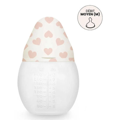 Baby bottle with a white body and a pink heart-patterned lid; 8 oz capacity with visible measurement markings.