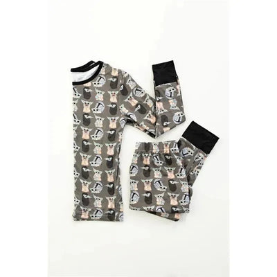 Bamboo pajamas for babies featuring a playful animal print in soft hues, with a long-sleeve top and matching pants.