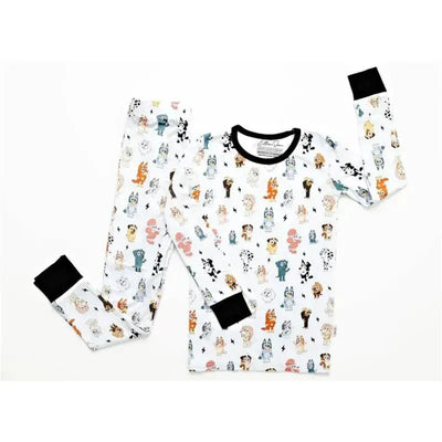 Blue dog-patterned bamboo pajamas featuring colorful cartoon dogs on a white background, with black cuffs.