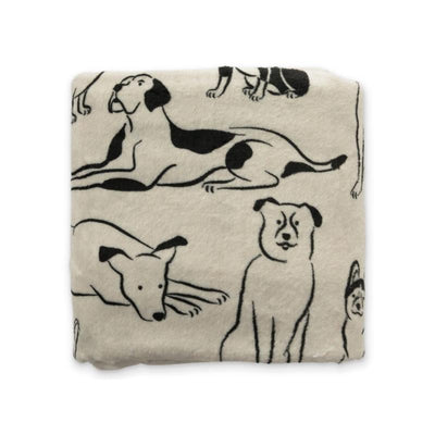 Double-sided throw blanket featuring various black and white dog illustrations on a cream background.