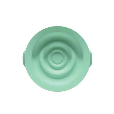 Breast pump seal with a rounded, textured design, in a soft mint color, intended for Elvie breast pumps.