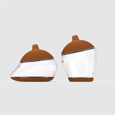 Starter kit featuring two Emulait nipples with deep brown caps and transparent bodies, designed for infant feeding.