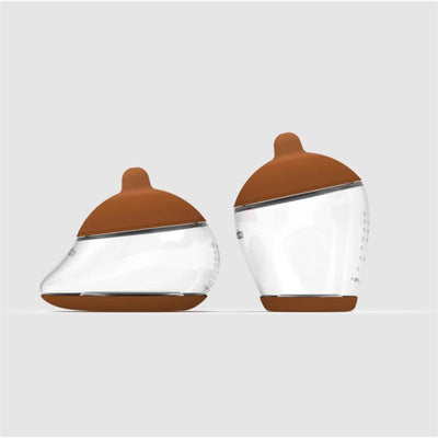 Nipple starter kit featuring two clear bottles with deep brown silicone nipples, designed for feeding.