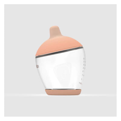 Classic bottle nipple in fair color with a soft silicone top and transparent body, designed for easy feeding.