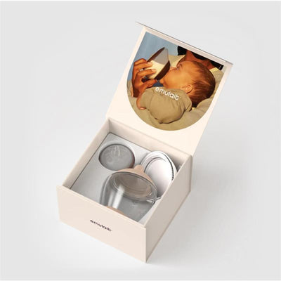 Classic bottle nipple set by Emulait, color fair and shape 4, displayed inside an open box with a baby photo on the lid.