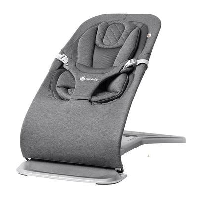 Ergobaby Evolve 3-in-1 Bouncer Seat in charcoal grey, featuring a cushioned seat, safety harness, and adjustable reclining position.