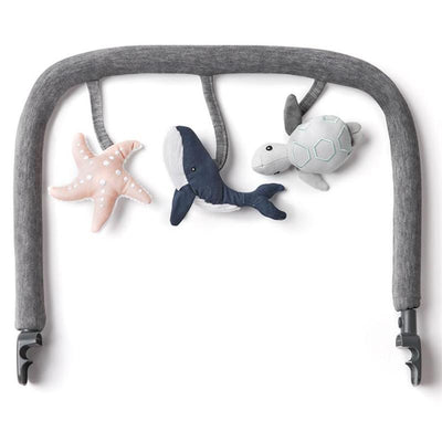 Ergobaby Evolve 3-in-1 Bouncer Toy Bar in Charcoal Grey featuring plush ocean-themed toys: a starfish, whale, and turtle.
