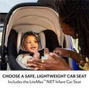 A happy infant in a LiteMax NXT car seat is smiles at a caregiver gesturing playfully, promoting safety and comfort.