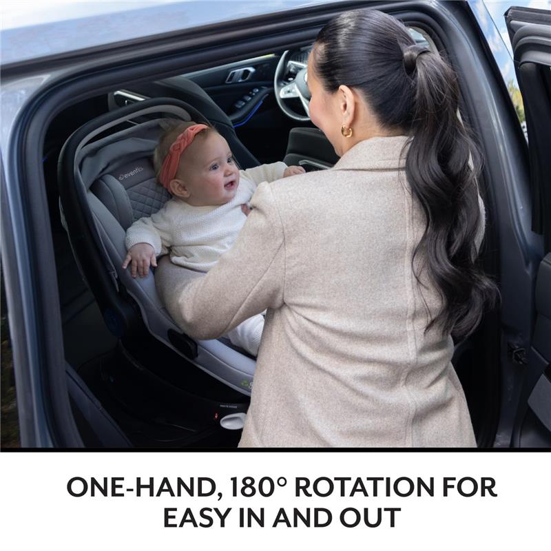 Evenflo Shyft Intuiti Travel System featuring the Revolve180 LiteMax NXT Infant Car Seat; a caregiver holds an infant in a vehicle.