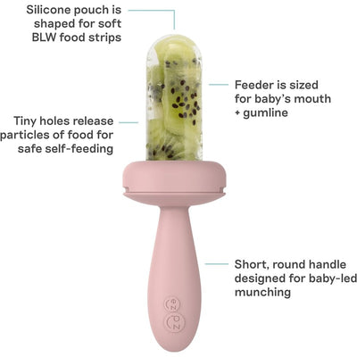 Silicone baby feeder in blush, featuring a textured pouch for soft food strips and a short handle for self-feeding.