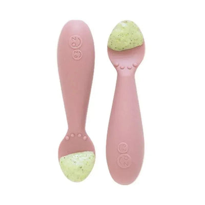 Tiny Spoon in blush color by Ezpz, featuring a silicone tip with green food, designed for easy feeding.