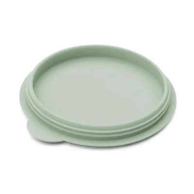 Tiny sage-colored silicone bowl lid designed to fit on Ezpz Tiny Bowls, ideal for keeping food fresh.