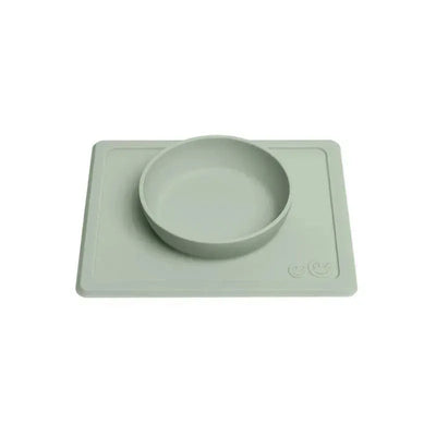 Sage-colored ezpz Mini Bowl with a flat mat base, designed to prevent spills and promote self-feeding.