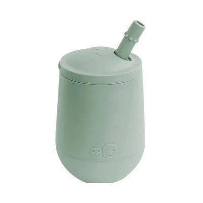 Mini Cup & Straw Training System by Ezpz, in sage green, designed for kids with a straw and spill-proof lid.