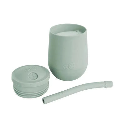 Ezpz Mini Cup & Straw Training System in sage color, featuring a cup, lid, and flexible straw for easy drinking.