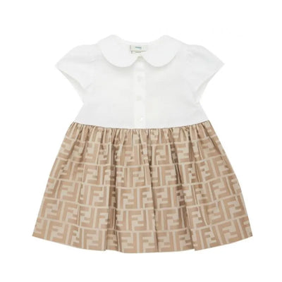 Short sleeve baby girl dress by Fendi, featuring a white top and beige skirt with repeated logo pattern and button details.